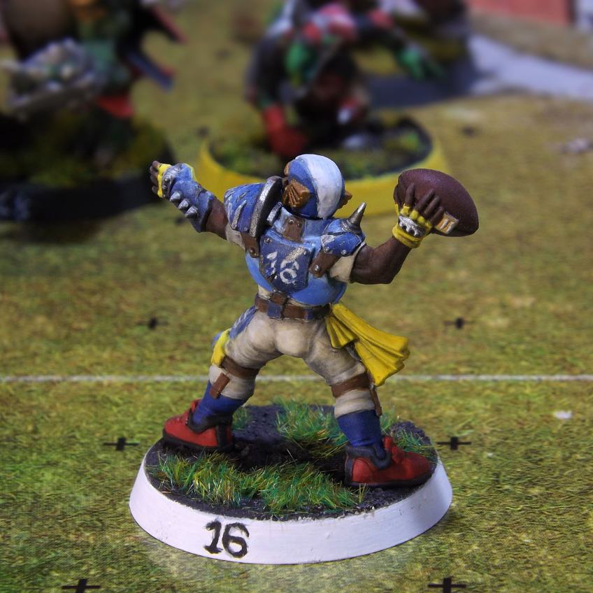 Human blood bowl thrower miniature painted in a blue colour scheme.